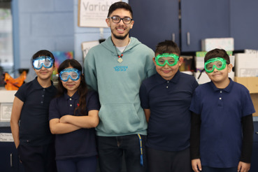 Photo of UCC Volunteer with science students