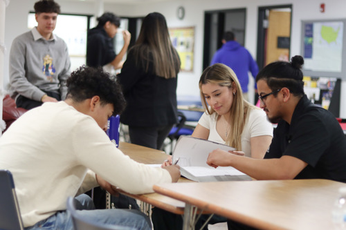 UCC Precollege Program students studying in a group at a desk