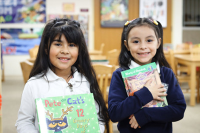 Students holding books